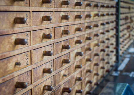 wood drawers that hold the lucky paperの写真素材