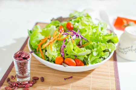 salad and salad cream on white backgroundの写真素材