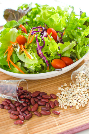 salad and salad cream on white backgroundの写真素材