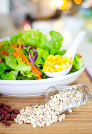 salad and salad cream on white backgroundの写真素材
