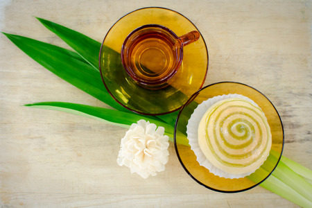 home made bun filled with steamed custard with pandan and teaの写真素材