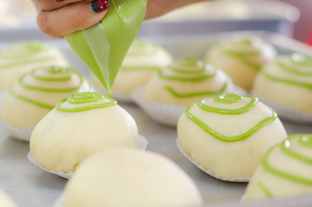 decorating bun before bakeの写真素材