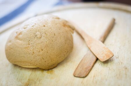 close up of coffee bun on wooden plateの写真素材