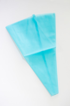blue piping bag on white backghroundの写真素材