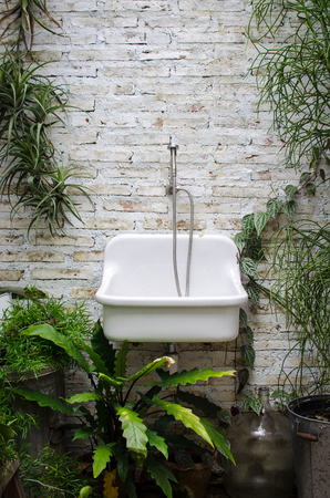 white sink in the forest bathroomの写真素材