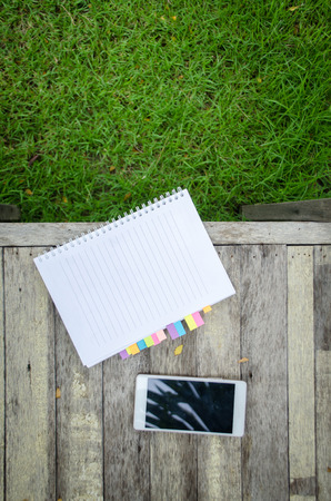 blank note book with colorfull post it grassの写真素材
