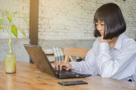 young woman working it cafeの写真素材