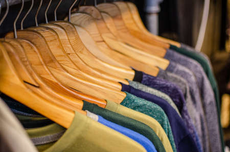 close up of wooden shirt hanger in fasion store