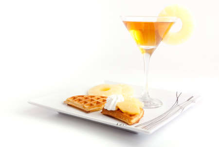 Pineapple Tart Slices with Fresh Juice In Cocktail Cup on Dishの写真素材