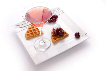 Cherries Tart Slices with Fresh Juice In Cocktail Cup on Dishの写真素材