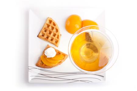 Drink with Peach Tart Slices with fresh vanilla creamの写真素材