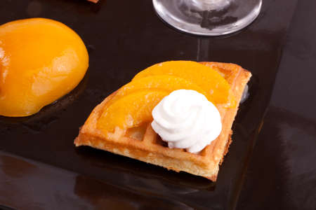 Peach Tart Slices with fresh vanilla cream on dishの写真素材