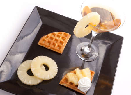 Pineapple juice with tart slices with fresh vanilla creamの写真素材