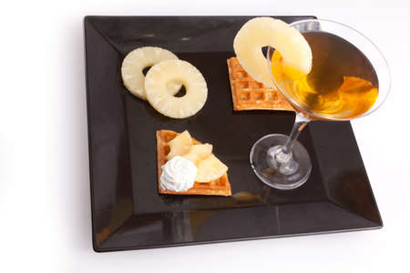 Pineapple juice with tart slices with fresh vanilla creamの写真素材