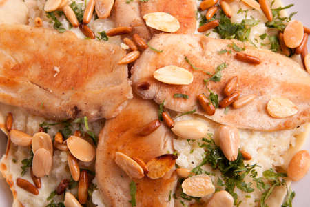 juicy grilled breasts chicken fillet with nutsの写真素材