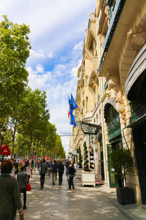 PARIS, FRANCE - February 20: The Champs-Elysees, on February 20, 2015 in Paris, France. Tourists stroll at The most famous avenue of Paris has 1910m and is full of stores, cafes and restaurantsのeditorial素材