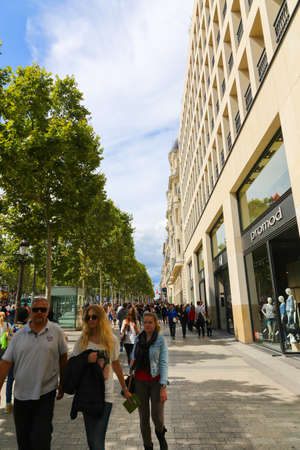 PARIS, FRANCE - February 20: The Champs-Elysees, on February 20, 2015 in Paris, France. Tourists stroll at The most famous avenue of Paris has 1910m and is full of stores, cafes and restaurantsのeditorial素材