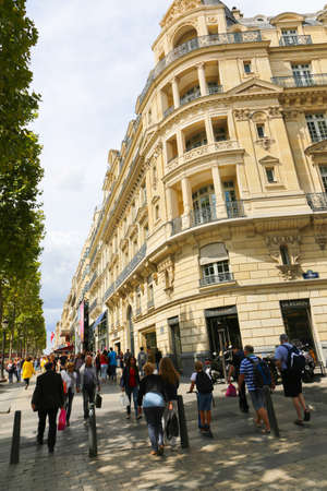 PARIS, FRANCE - February 20: The Champs-Elysees, on February 20, 2015 in Paris, France. Tourists stroll at The most famous avenue of Paris has 1910m and is full of stores, cafes and restaurantsのeditorial素材