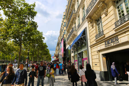 PARIS, FRANCE - February 20: The Champs-Elysees, on February 20, 2015 in Paris, France. Tourists stroll at The most famous avenue of Paris has 1910m and is full of stores, cafes and restaurantsのeditorial素材