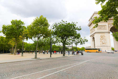 PARIS, FRANCE - February 20: The Champs-Elysees and the Arc de Triomphe, on February 20, 2015 in Paris, France. Tourists stroll at The most famous avenue of Paris has 1910m and is full of stores, cafes and restaurantsのeditorial素材