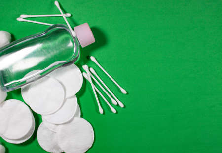 healthy skin care cosmetic elements on green background .top viewの写真素材