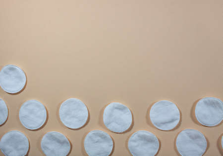 cotton pads on a light beige background top viewの写真素材