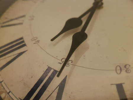 A vintage clock with roman time numbers, clockwise points to 7:35, Karbala, Iraq.