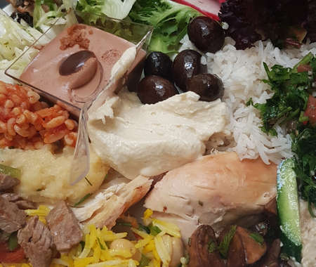 an open buffet plate filled with foodの写真素材