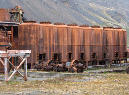 Old rusting boilers and whale oil storage tanks at the old whaling station in Grytviken, South Geoergiaの写真素材