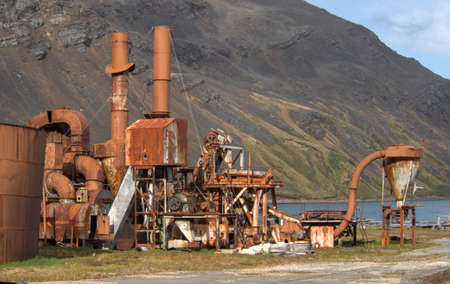 Old rusting boilers and whale oil storage tanks at the old whaling station in Grytviken, South...