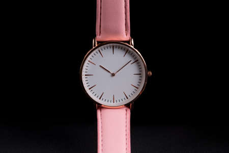 Single wrist watch on a black backgroundの写真素材