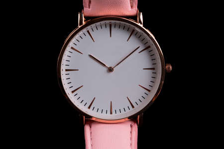 Single wrist watch on a black backgroundの写真素材