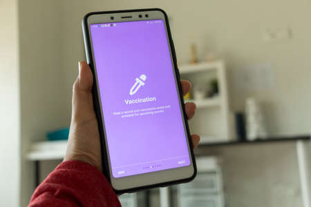 Negeri Sembilan, Malaysia - August 29, 2018: Healthcare application on smartphone. This application keeps vaccination record event and schedule.のeditorial素材
