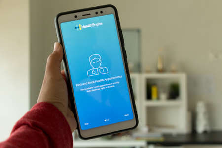 Negeri Sembilan, Malaysia - August 29, 2018: HealthEngine application on smartphone. This application finds and book health appointments.のeditorial素材