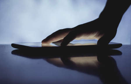 hand touching screen on modern digital tablet pc.の写真素材