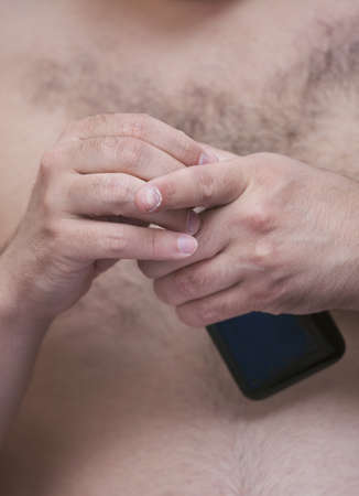 Close up of a man hide mobile smart phoneの写真素材