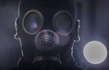 a man in a gas mask with the abstract background の写真素材