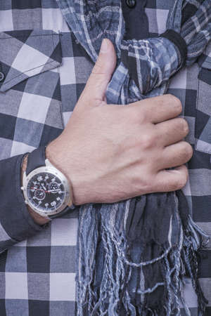 Close up of man fixing his scarfの写真素材