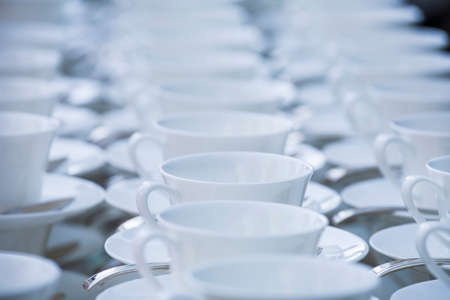 Many rows of pure white cup and saucer designed in modern style.の写真素材