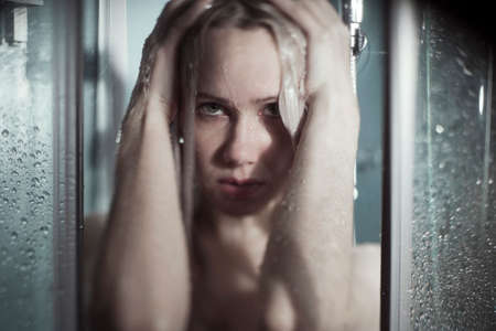 Portrait of beautiful woman bathing in darkness