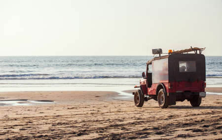 Rescue car on the beach near the sea