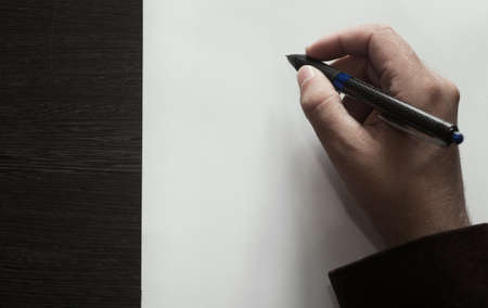 Hand drawing on white paper sheetの写真素材