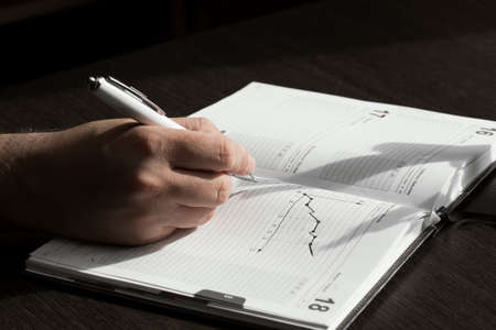 Businessman's hand with penの写真素材