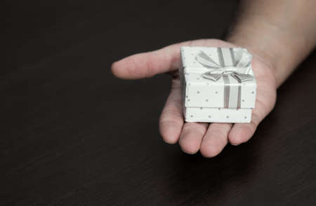 Hand with small presentの写真素材