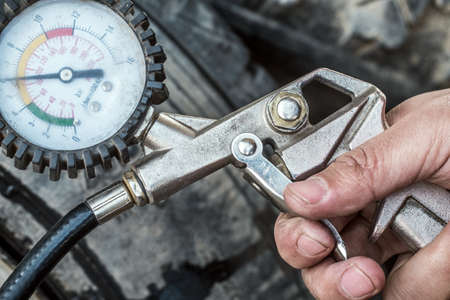 Inflating the wheels with Compressorの写真素材