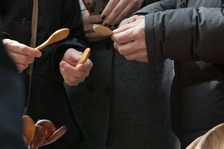 Hands holding wooden spoonの写真素材