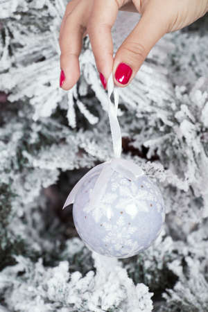 Decorating christmas tree with toyの写真素材