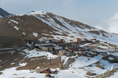Winter village in the mountainsの写真素材