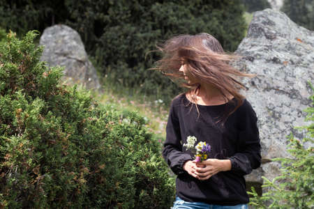 Portrait of romantic woman with bouquetの写真素材