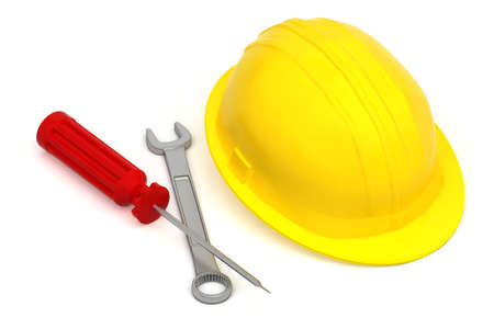 work tools and hardhat isolated on white background - screwdriver and wrench near a yellow worker hatの写真素材